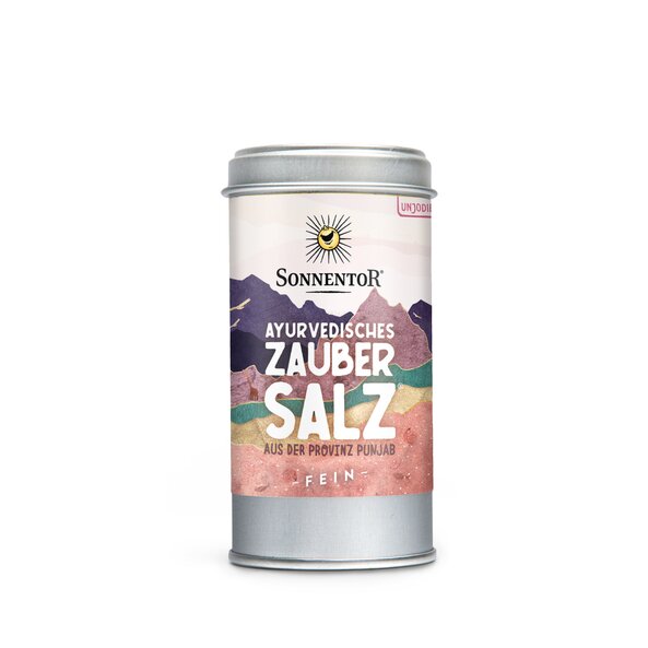 Photo of a spice tin of Ayurveda Magic Salt. On the tin you can see mountains with different colors.